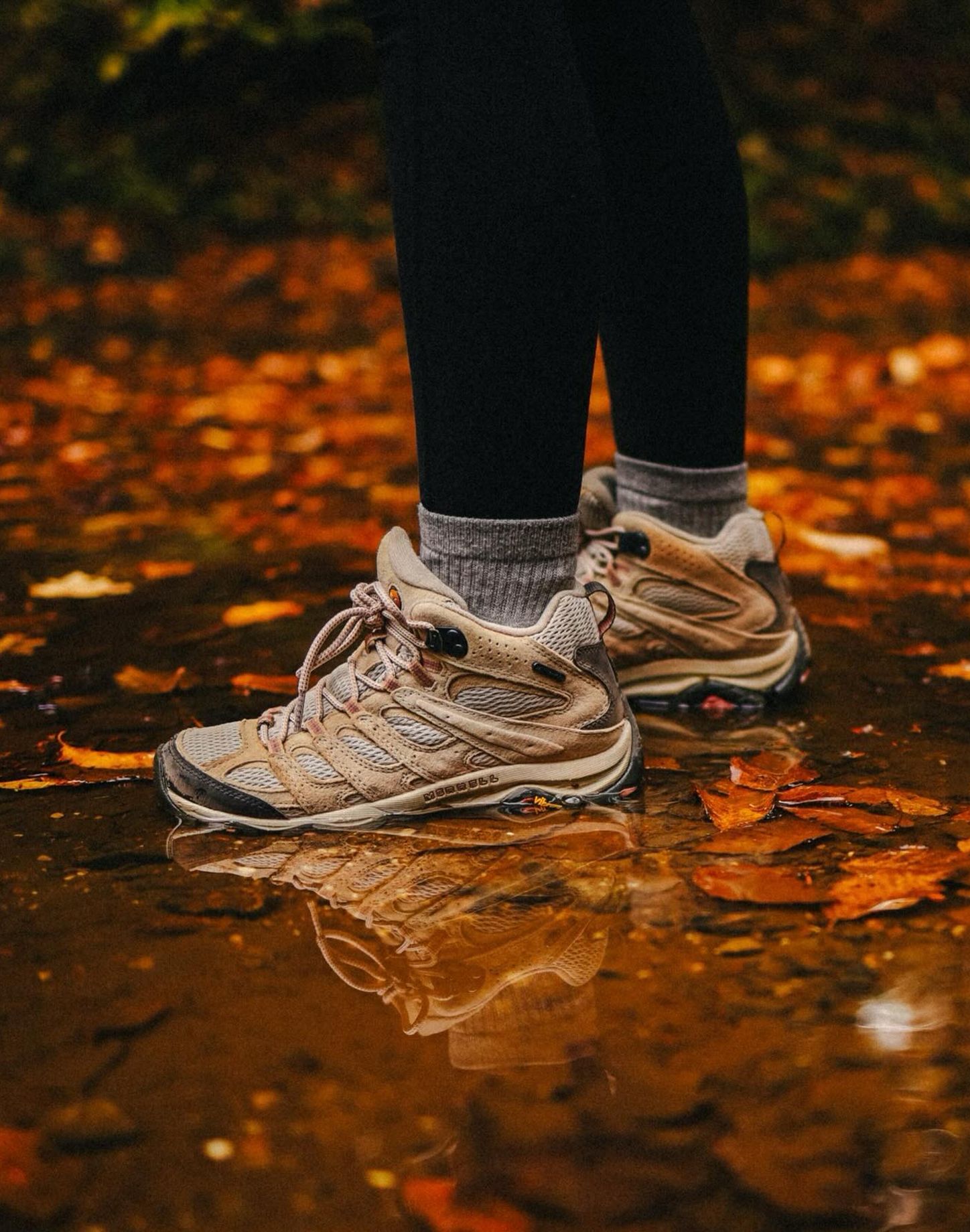 Man in woods wearing Merrell hiking boots